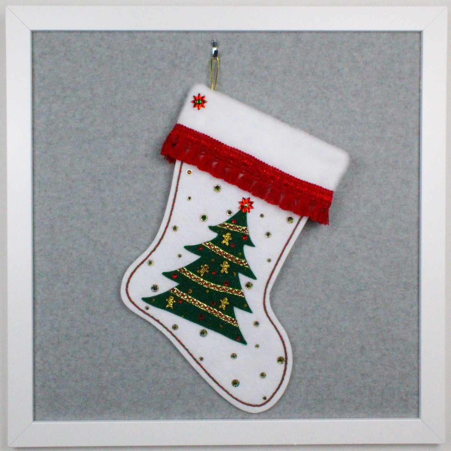Dark green glitter Xmas tree on white glitter handmade OOAK Christmas stocking decorated with gold acrylic  gingerbread men, poinsettia rhinestone, red tassel fringe, with green and gold accents.