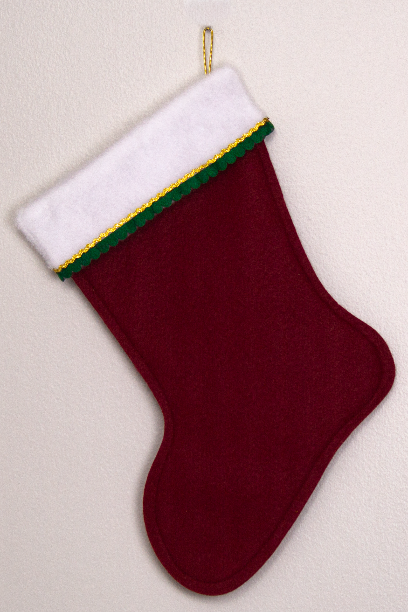 Ruby red felt handmade Christmas stocking, decorated in gold & dark green (back of Tree stocking)