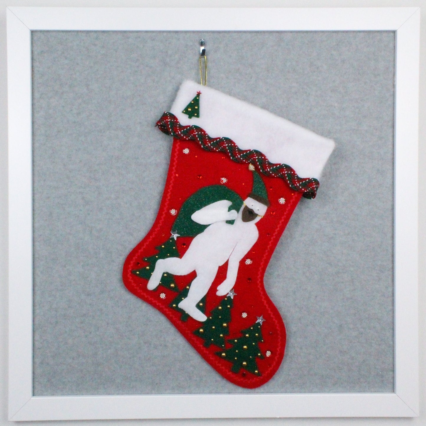 White yeti Santa on red glitter felt OOAK handmade Christmas stocking with dark green trees and gold decoration.