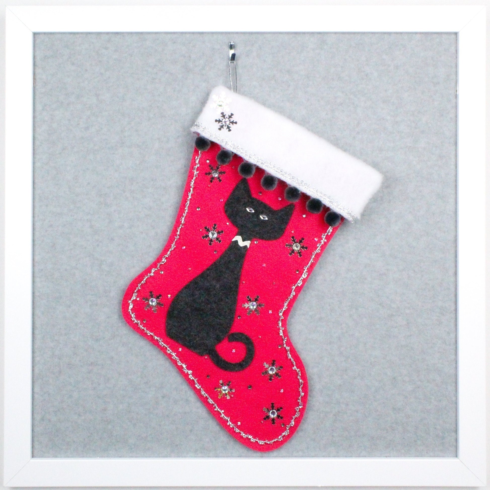 Dark gray cat on shocking pink felt handmade OOAK Christmas stocking with silver decorations and gray pom poms.