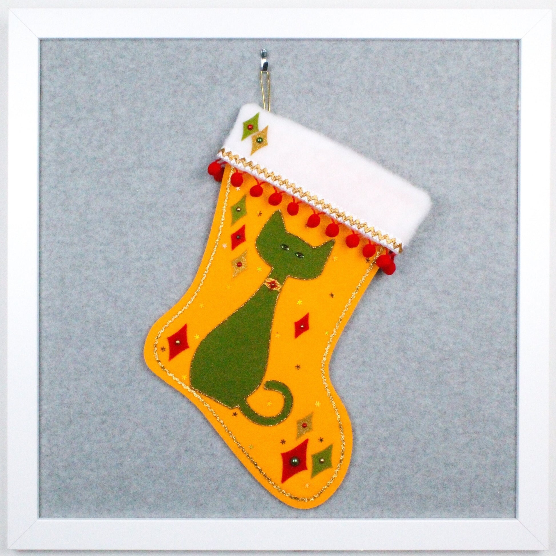 Avocado green cat on gold felt handmade OOAK Christmas stocking with red and sparkly gold decorations.