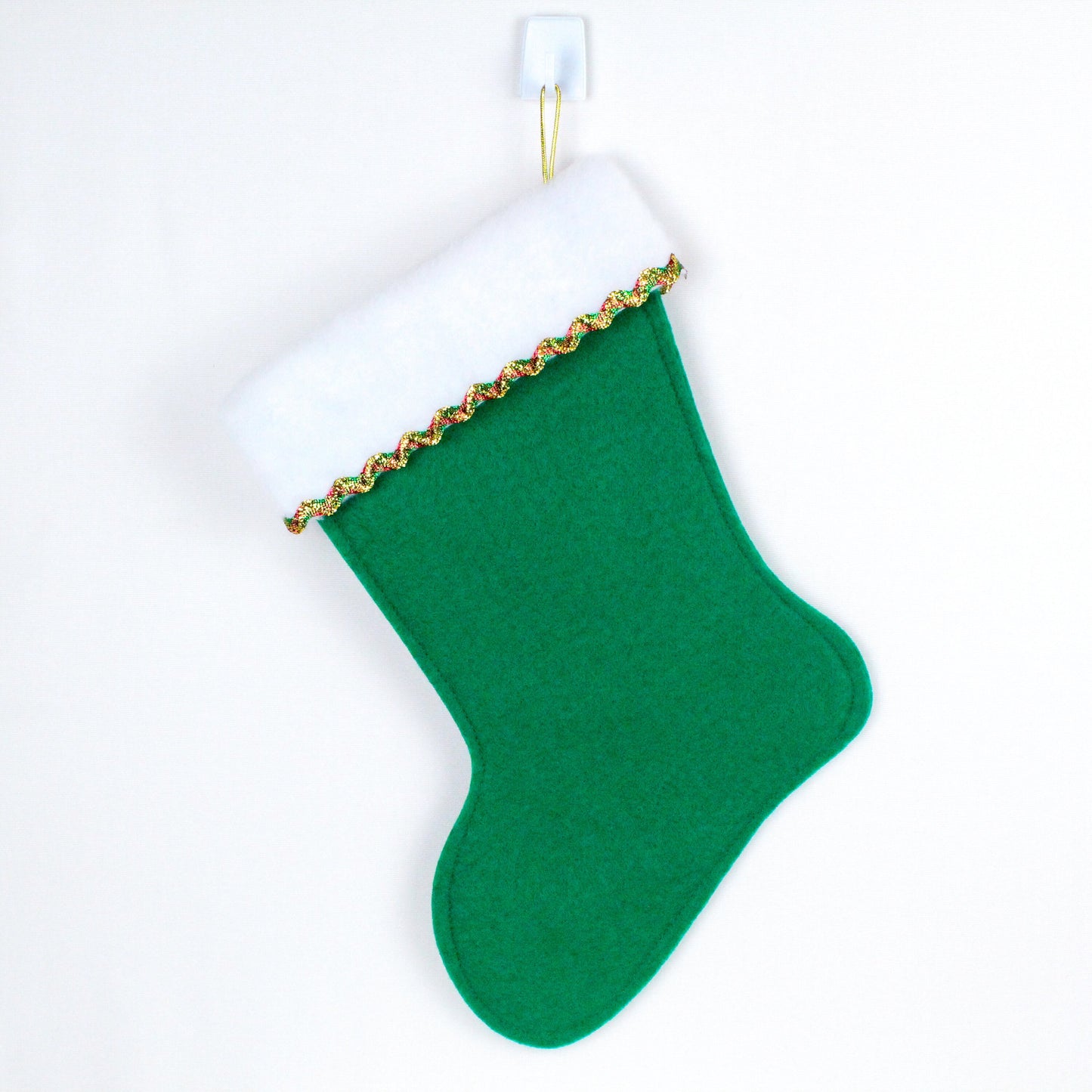 Tan cat on green felt Christmas stocking