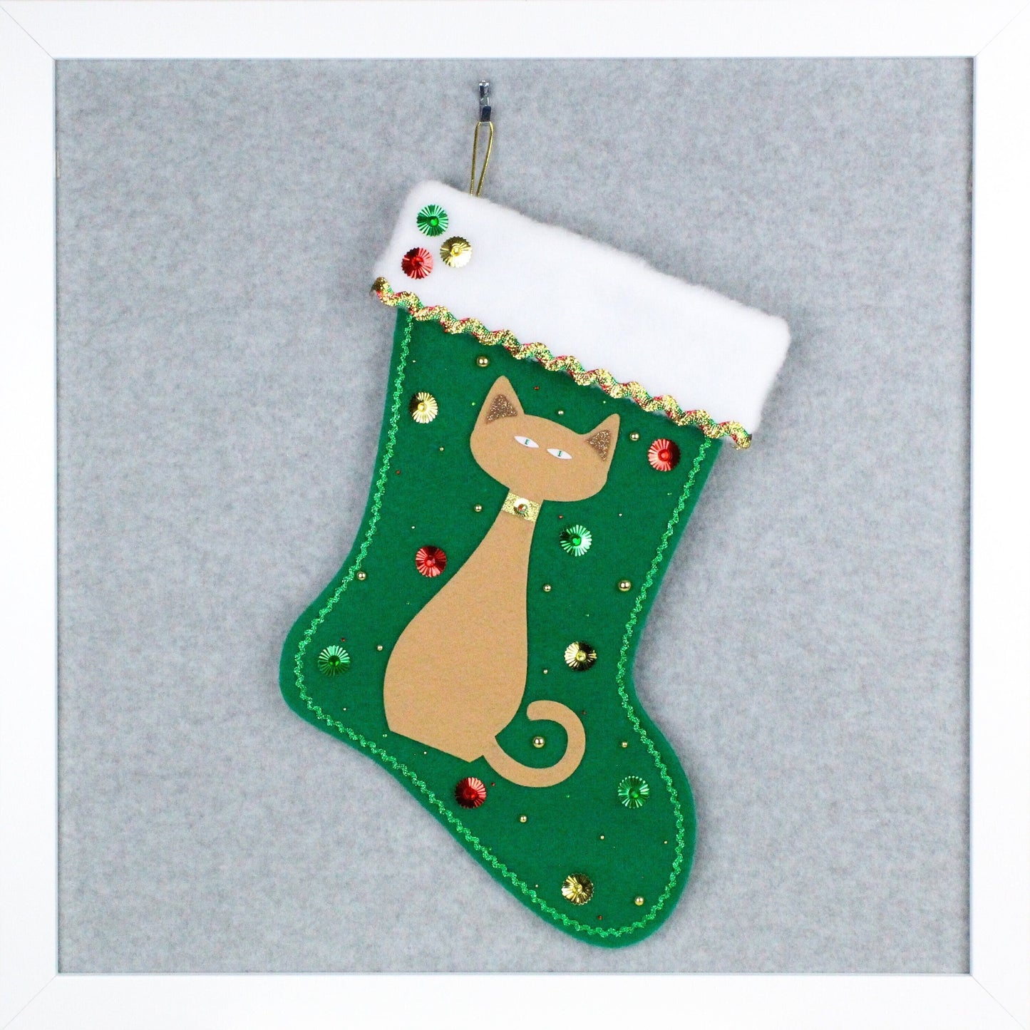 Tan cat on holiday green felt handmade OOAK Christmas stocking with red and gold decorations.