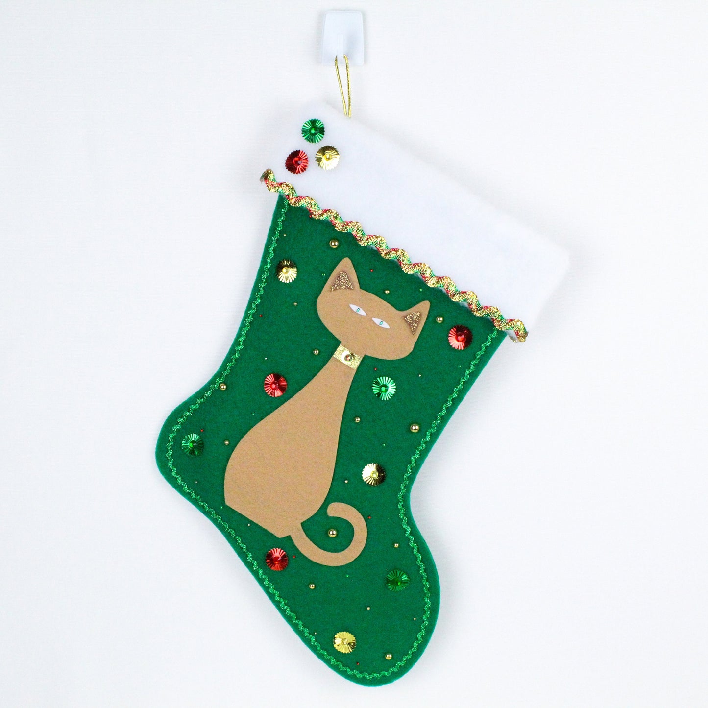 Tan cat on green felt Christmas stocking