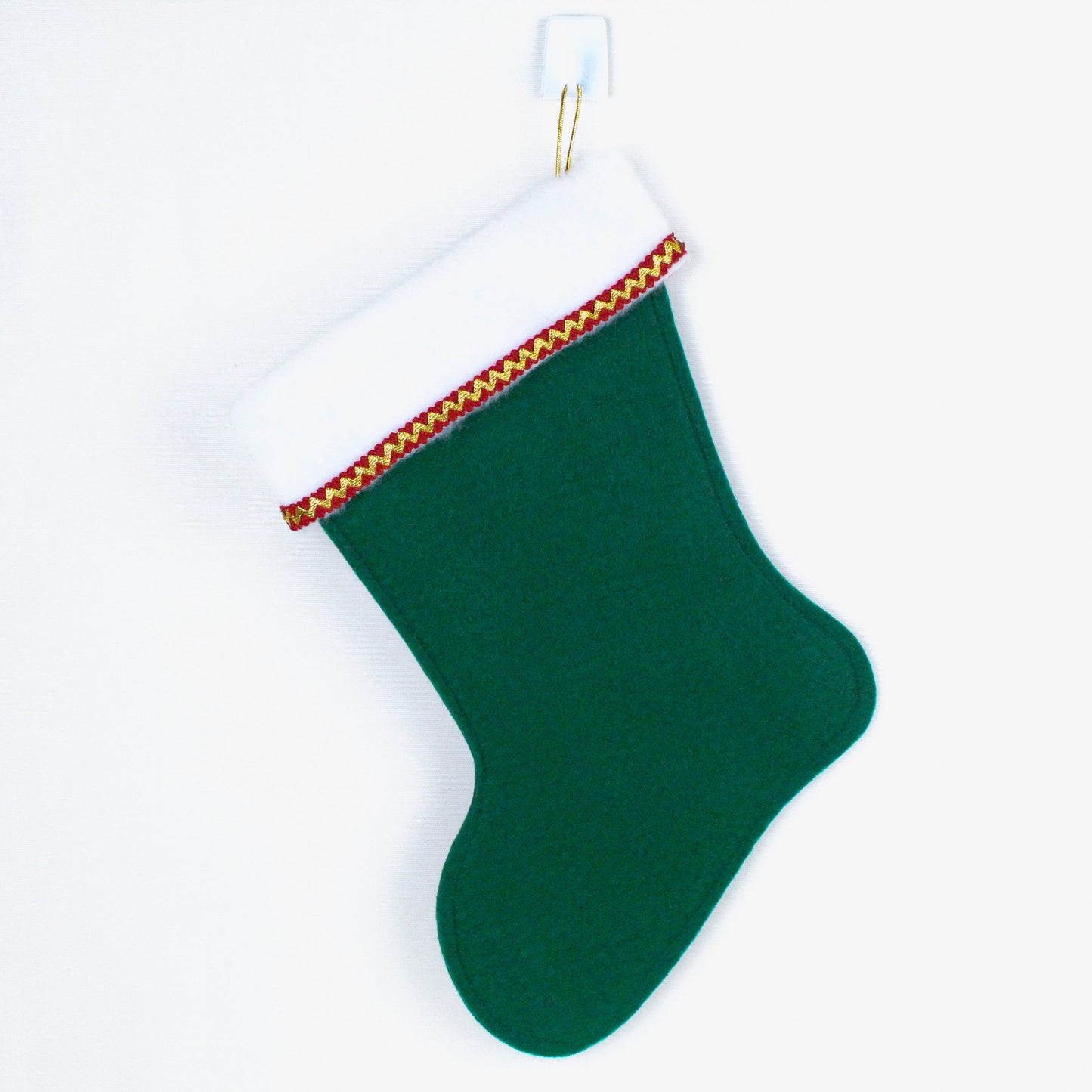 Cream cat on green felt Christmas stocking