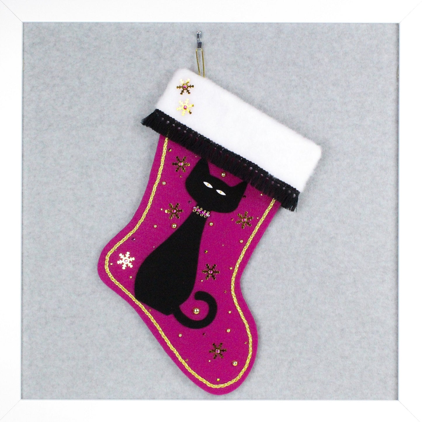 Black cat on fuchsia felt OOAK handmade Christmas stocking with snowflakes, tassel fringe and gold decorations.