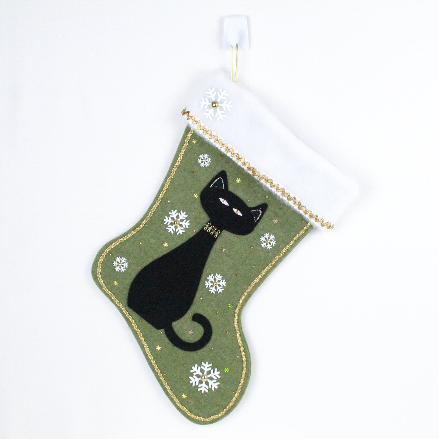 Black cat on green felt Christmas stocking