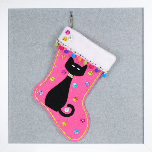 Black cat on candy pink felt one of a kind handmade Christmas stocking with multicolor and gold decorations.