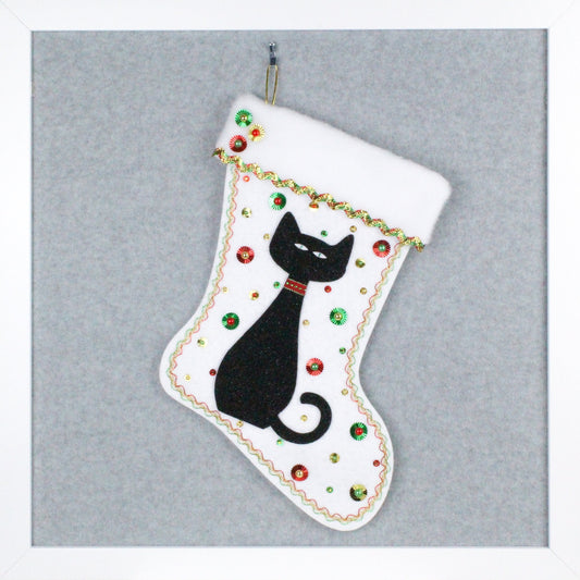 Black glitter cat on white glitter felt handmade one of a kind Christmas stocking with red, green and gold decorations.