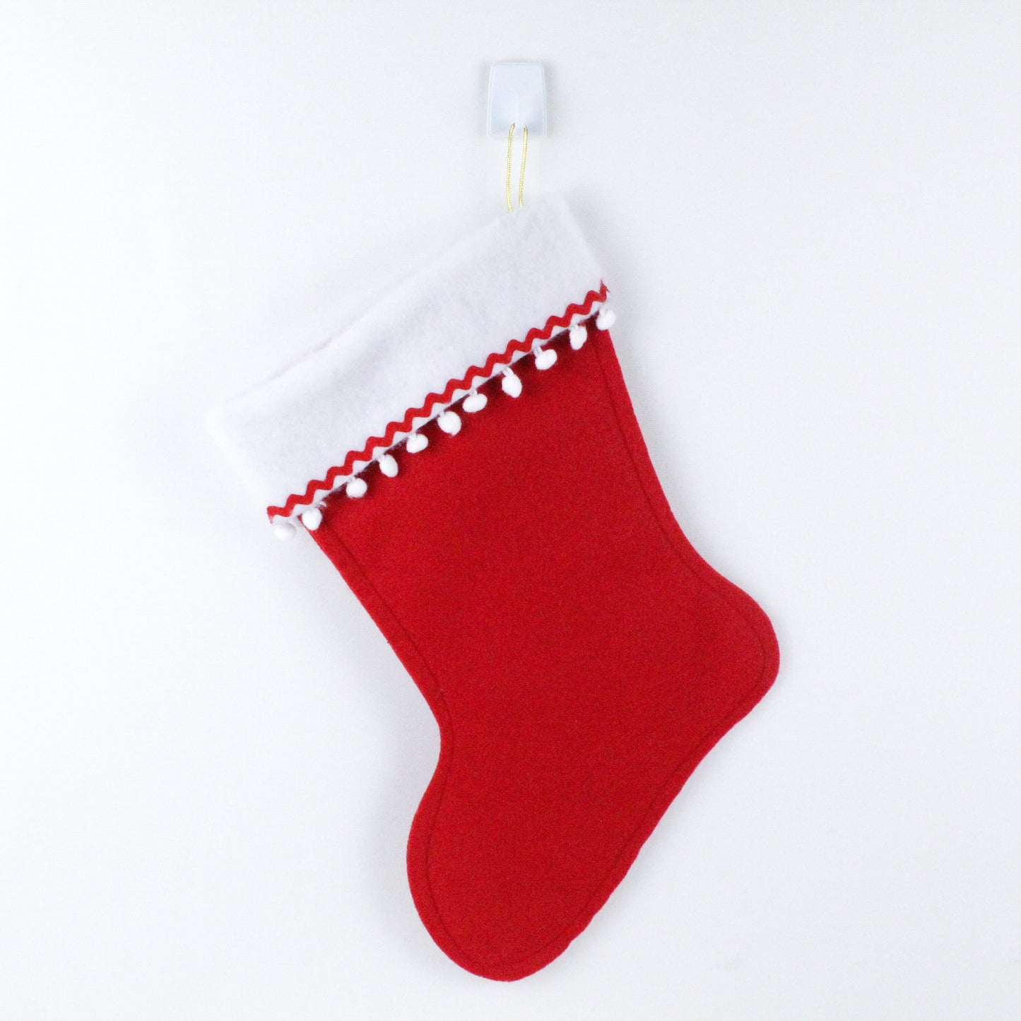 Beige cat on red felt Christmas stocking