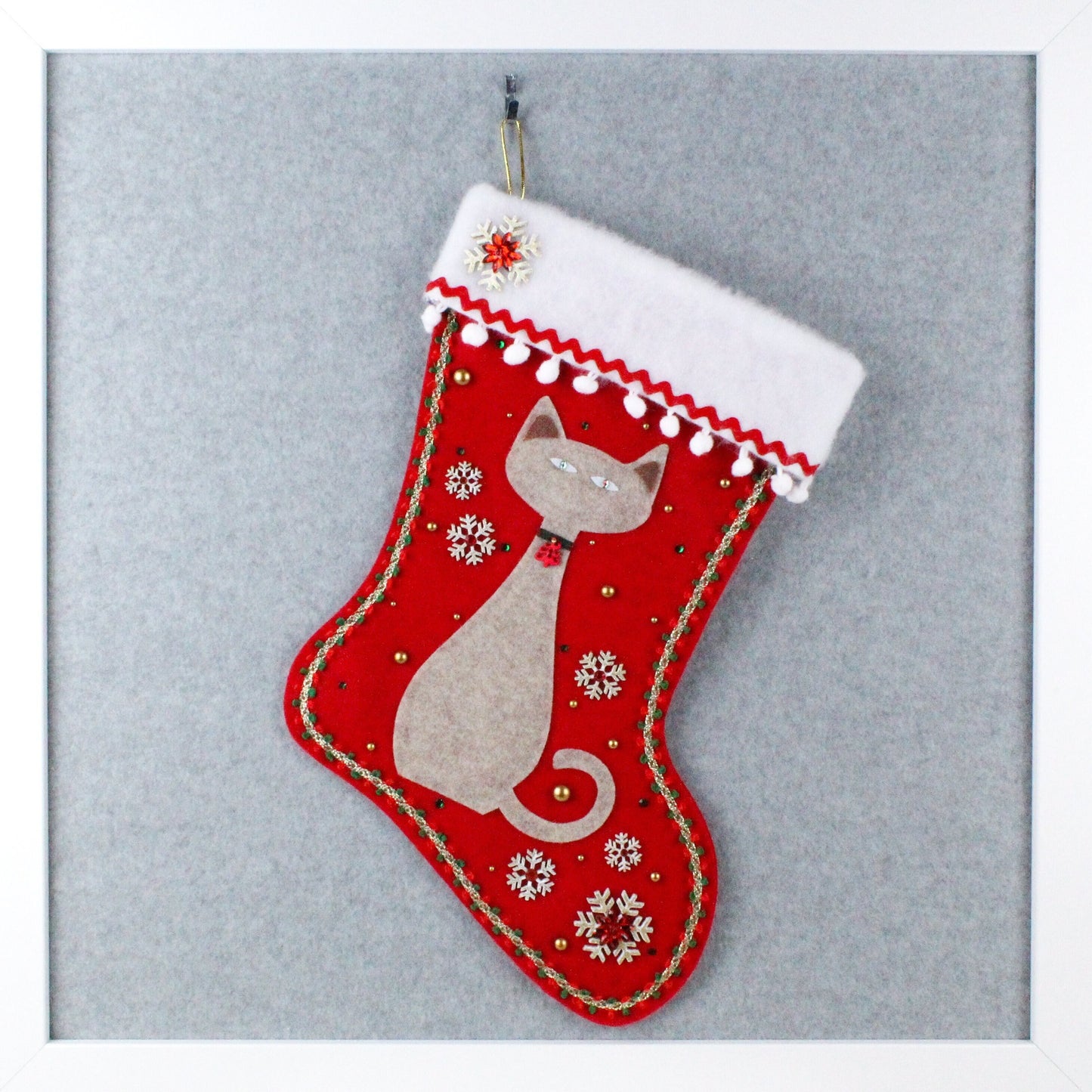 Sandstone tan cat on holiday red felt handmade OOAK Christmas stocking with gold snowflakes, white and green decorations.