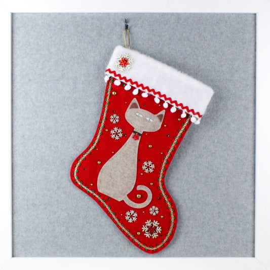 Sandstone tan cat on holiday red felt handmade OOAK Christmas stocking with gold snowflakes, white and green decorations.